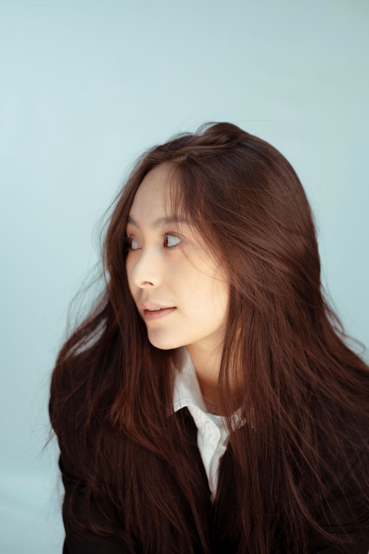 Editorial portrait featuring long, flowing brunette hair